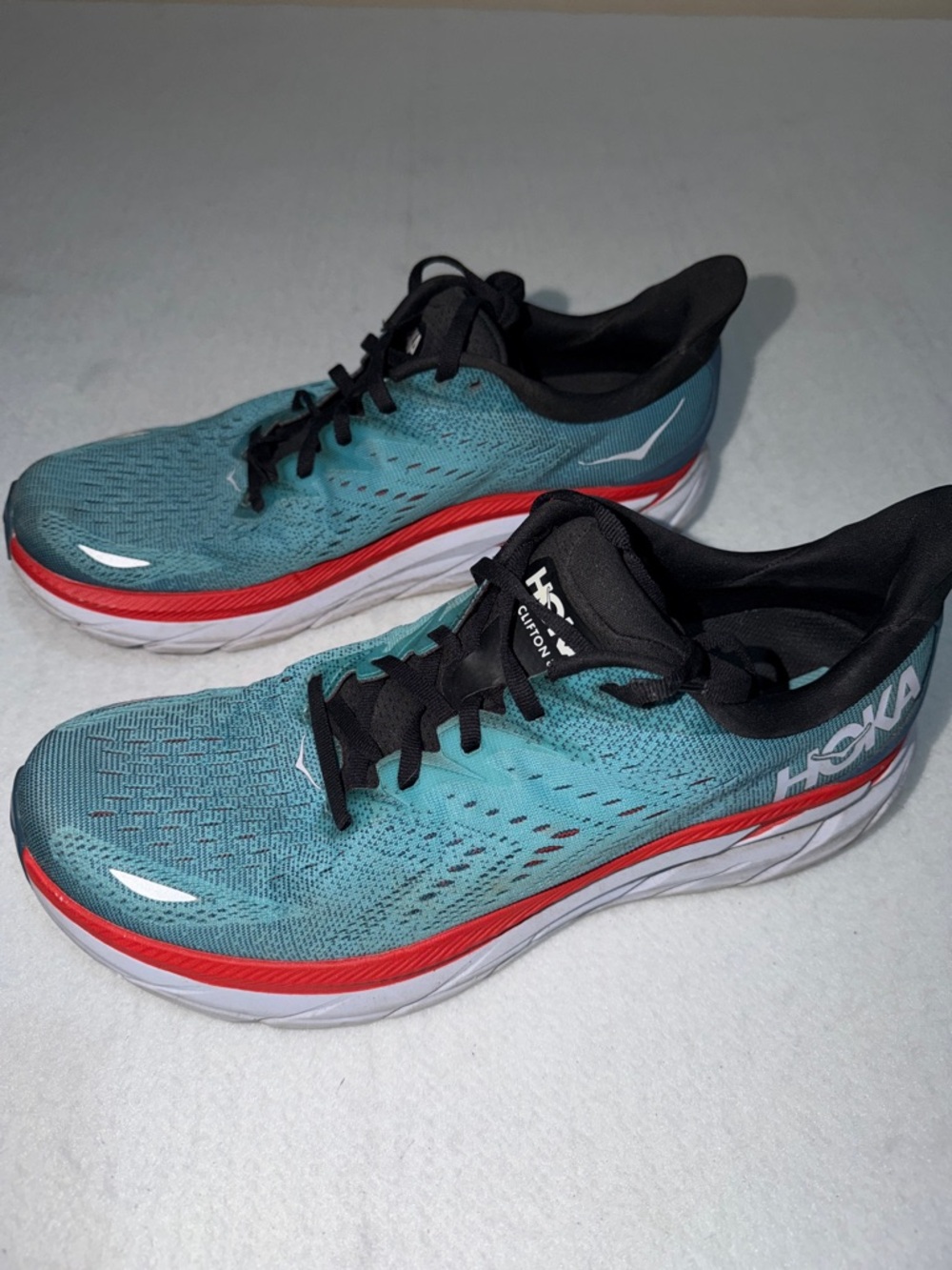 Hoka Teal Running Shoes with Red and Black Accents 10.5D S34x22 V655 W250